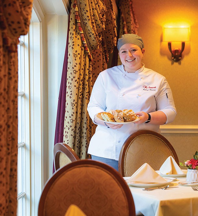 The Gatesworth Pastry Chef holding a plate of pastries.