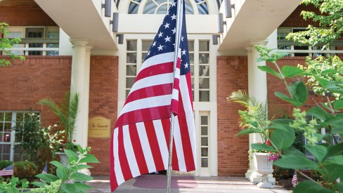 The American flag outside in the entryway.