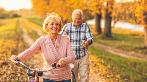seniors bicycling in autumn